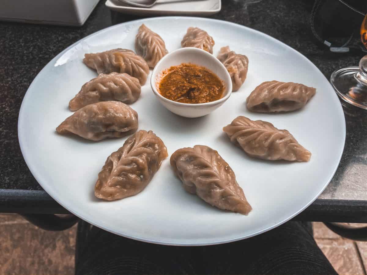 Trying momos in Nepal